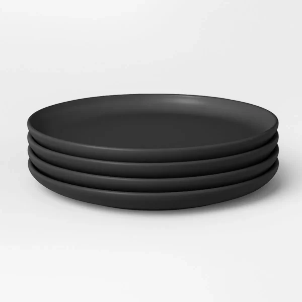 Set of four 6-inch black appetizer plates, perfect for serving snacks and appetizers.
