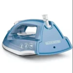 BLACK+DECKER Variable Control Compact Iron, black and blue, on a ironing board.