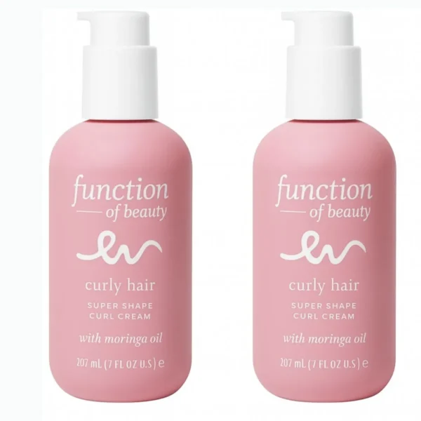 Two pink bottles of Function of Beauty's customizable curl cream for curly hair, formulated with Moringa oil.