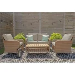 Beige Hampton Bay 4-piece wicker patio conversation set with cushions, perfect for Toronto backyards.