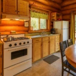 Unique Appliances 6 cu ft white propane refrigerator with adjustable shelves, perfect for cottages and off-grid living.