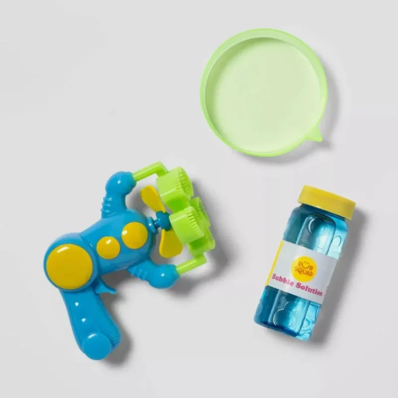 Kids playing with the Sun Squad Super Bubble Blaster, creating colorful bubbles outdoors.