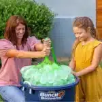 100 Zuru Bunch O Balloons in red, white, and blue, ready for a summer water fight. Self-sealing design for easy filling.