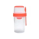 Coral red 20 oz multi-compartment cereal cup with spoon, perfect for healthy on-the-go meals.