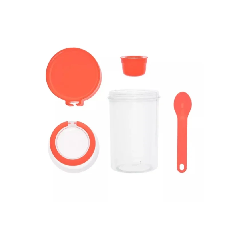 Coral red 20 oz multi-compartment cereal cup with spoon, perfect for healthy on-the-go meals.