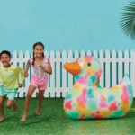 Yellow Sun Squad duck-shaped ride-on pool float with handles, perfect for kids and adults. Enjoy summer fun in Toronto!