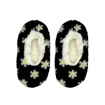 Charcoal grey slipper socks with a white and yellow daisy pattern and a white sherpa lining.