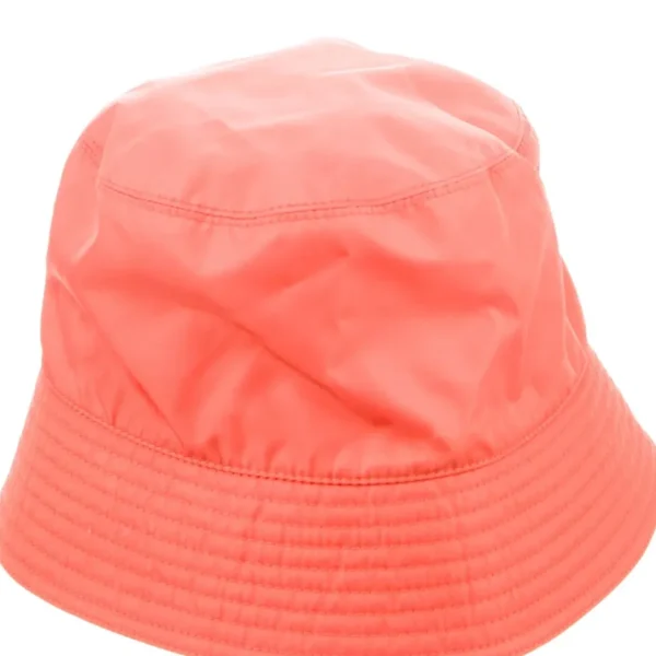 Adorable girl wearing a white Jan & Jul bucket hat with UPF 50+ sun protection.