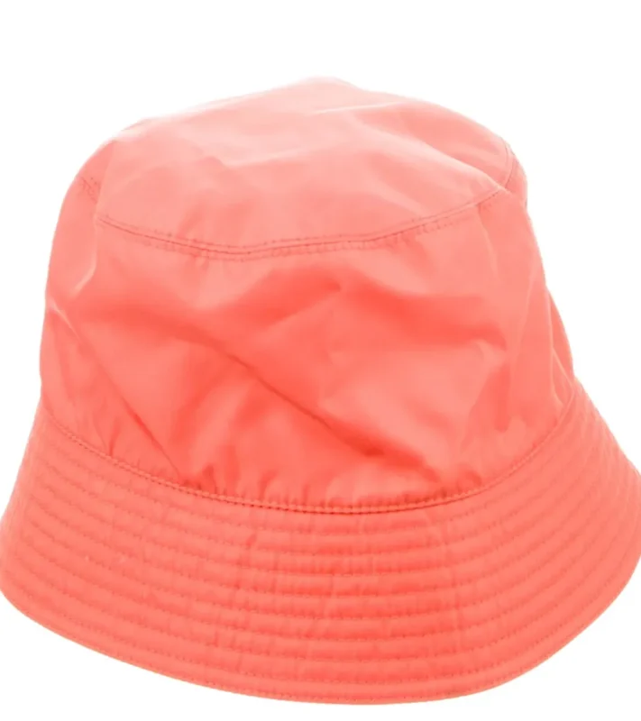 Adorable girl wearing a white Jan & Jul bucket hat with UPF 50+ sun protection.