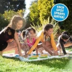 Kids playing the Hasbro Twister Splash water game in a sunny backyard.