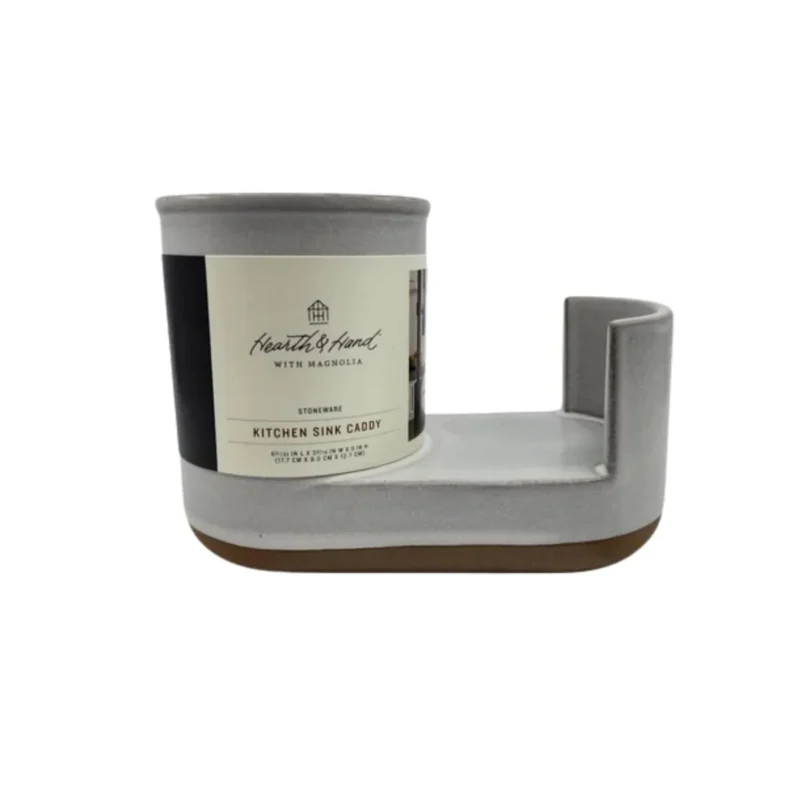 Cream and clay colored Hearth & Hand Magnolia stoneware kitchen sink caddy, organizing dish soap and sponges.