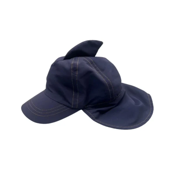 Adorable child wearing a Pool brand flat-back sun hat, perfect sun protection for summer.