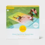 Kids playing on a giant ombre Sun Squad water blob in a backyard.