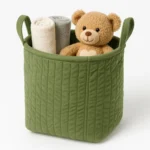 Elegant green velvet storage bin with handles, perfect for home organization. Shop local in Toronto!