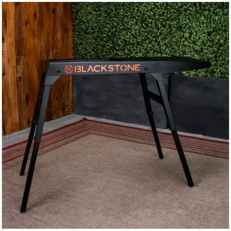 Blackstone griddle outdoor cooking scene on patio Blackstone griddle close-up of flat top surface Blackstone griddle portable setup for camping Blackstone griddle sizzling breakfast on grill Blackstone griddle easy cleanup and grease management
