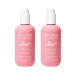 Two pink bottles of Function of Beauty's customizable curl cream for curly hair, formulated with Moringa oil.