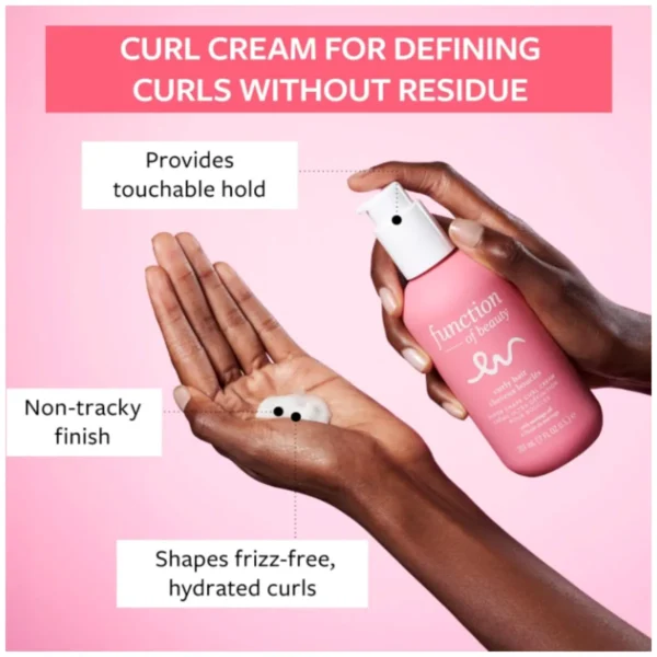 Two pink bottles of Function of Beauty's customizable curl cream for curly hair, formulated with Moringa oil.