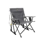 GCI Outdoor camping chair at a forest campsite GCI Outdoor camping chair folded for easy carry GCI Outdoor camping chair lightweight portable design GCI Outdoor camping chair durable frame close-up GCI Outdoor camping chair compact storage in trunk