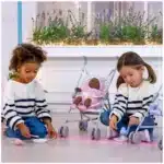 JC Toys baby doll realistic playtime close-up JC Toys baby doll soft, huggable design JC Toys baby doll held by child for pretend play JC Toys baby doll durable details and features JC Toys baby doll gift-ready packaging view