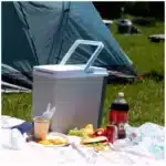 Koolatron cooler portable unit front view Koolatron cooler in a home or office setting Koolatron cooler compact design close-up Koolatron cooler packed for travel and road trips Koolatron cooler lifestyle scene at a picnic