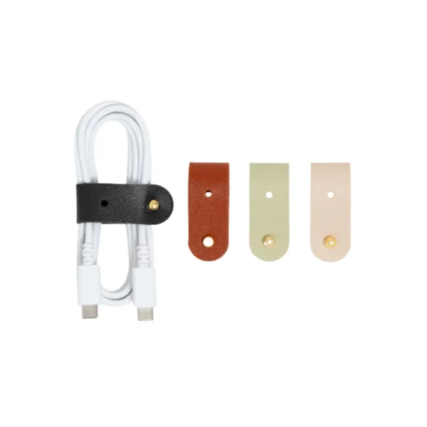 vegan leather cable organizer by U Brands on desk vegan leather cable organizer for tidy charging cables vegan leather cable organizer closeup of stitching detail vegan leather cable organizer holding USB and power cords vegan leather cable organizer minimalist workspace accessory
