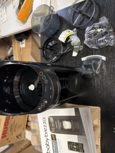 Baby Brezza formula dispenser machine automatically mixes warm formula bottles