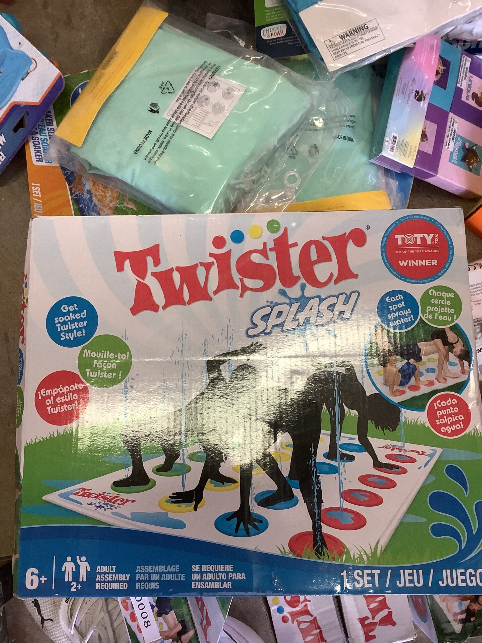 Hasbro twister splash game in colourful backyard setup