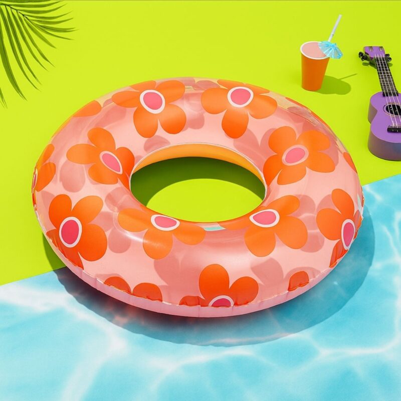 Sun Squad™ inflatable swim tube in vibrant orange with flower design
