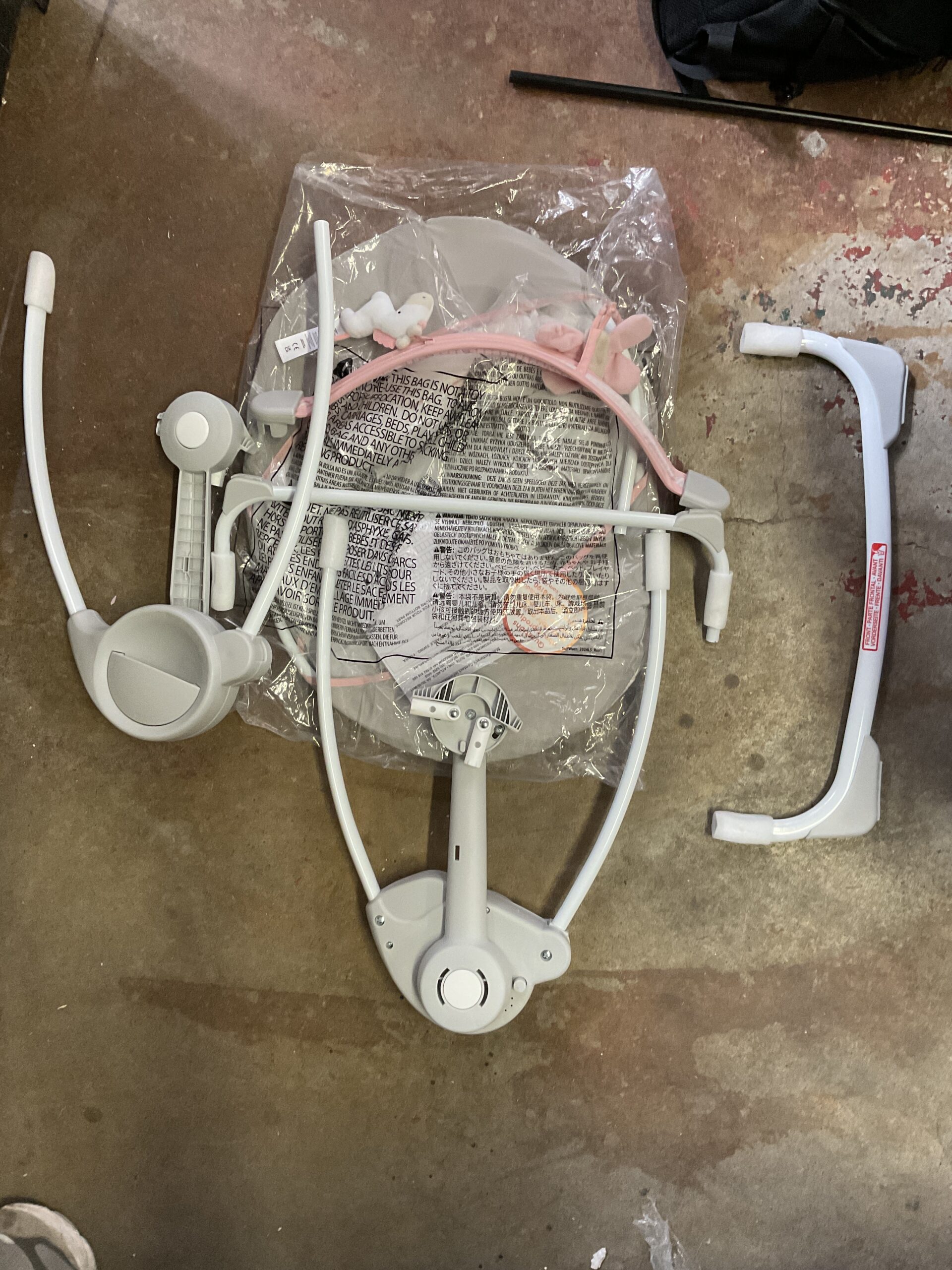 Ingenuity portable baby swing in pink with music feature