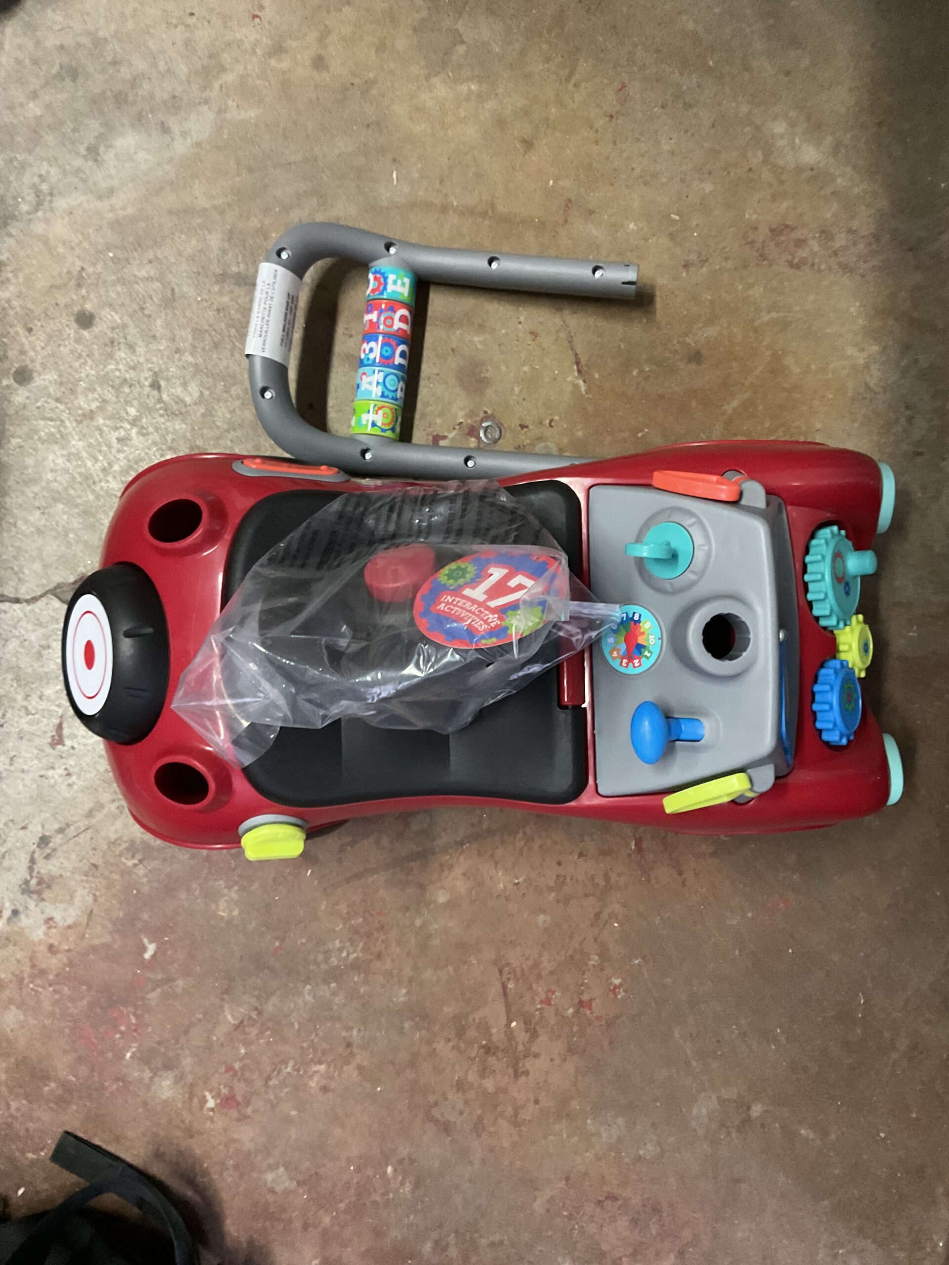 Radio toddler ride on toy in red with interactive features