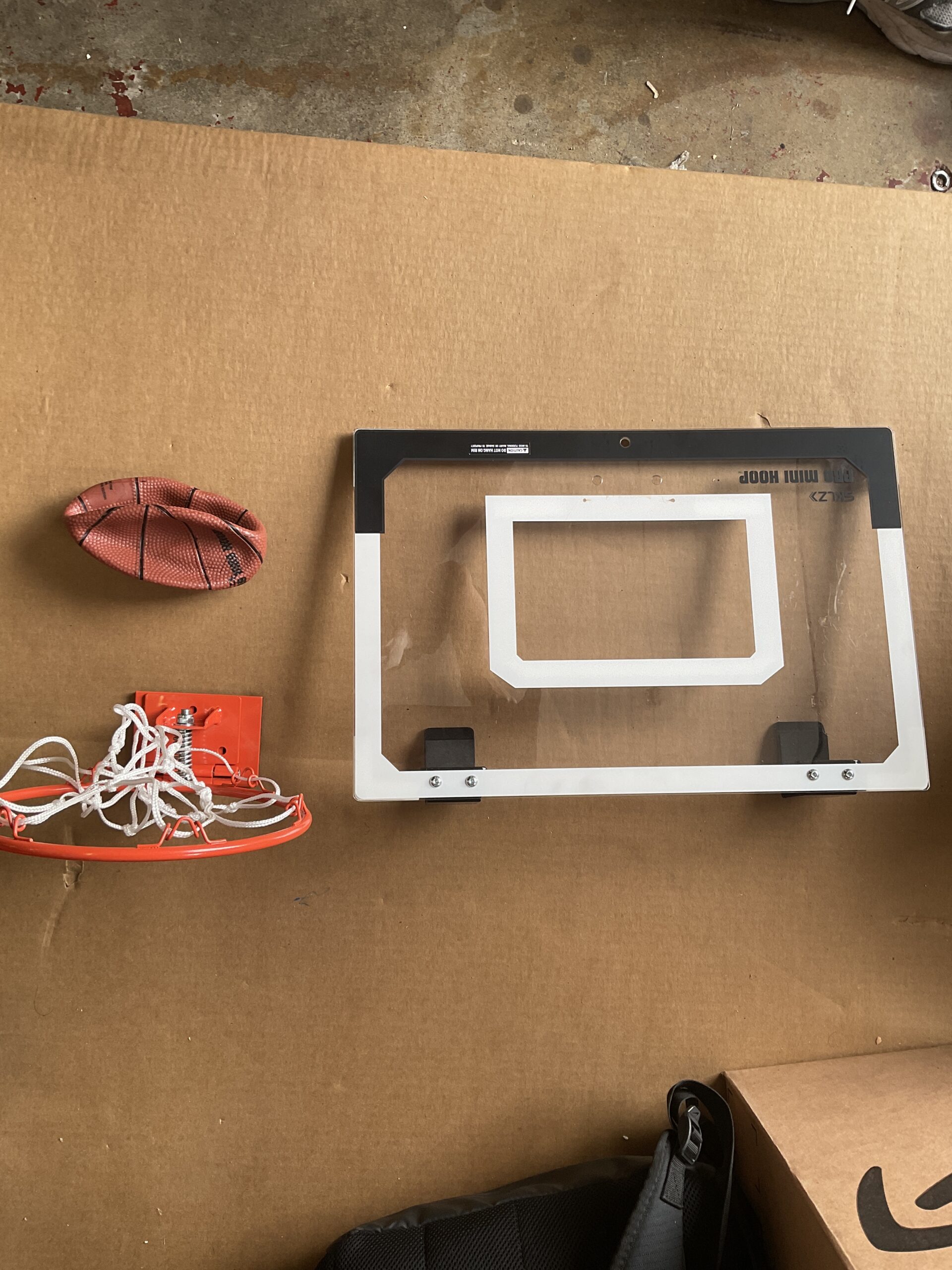 Sklz mini basketball hoop with 18x12 inch shatterproof backboard