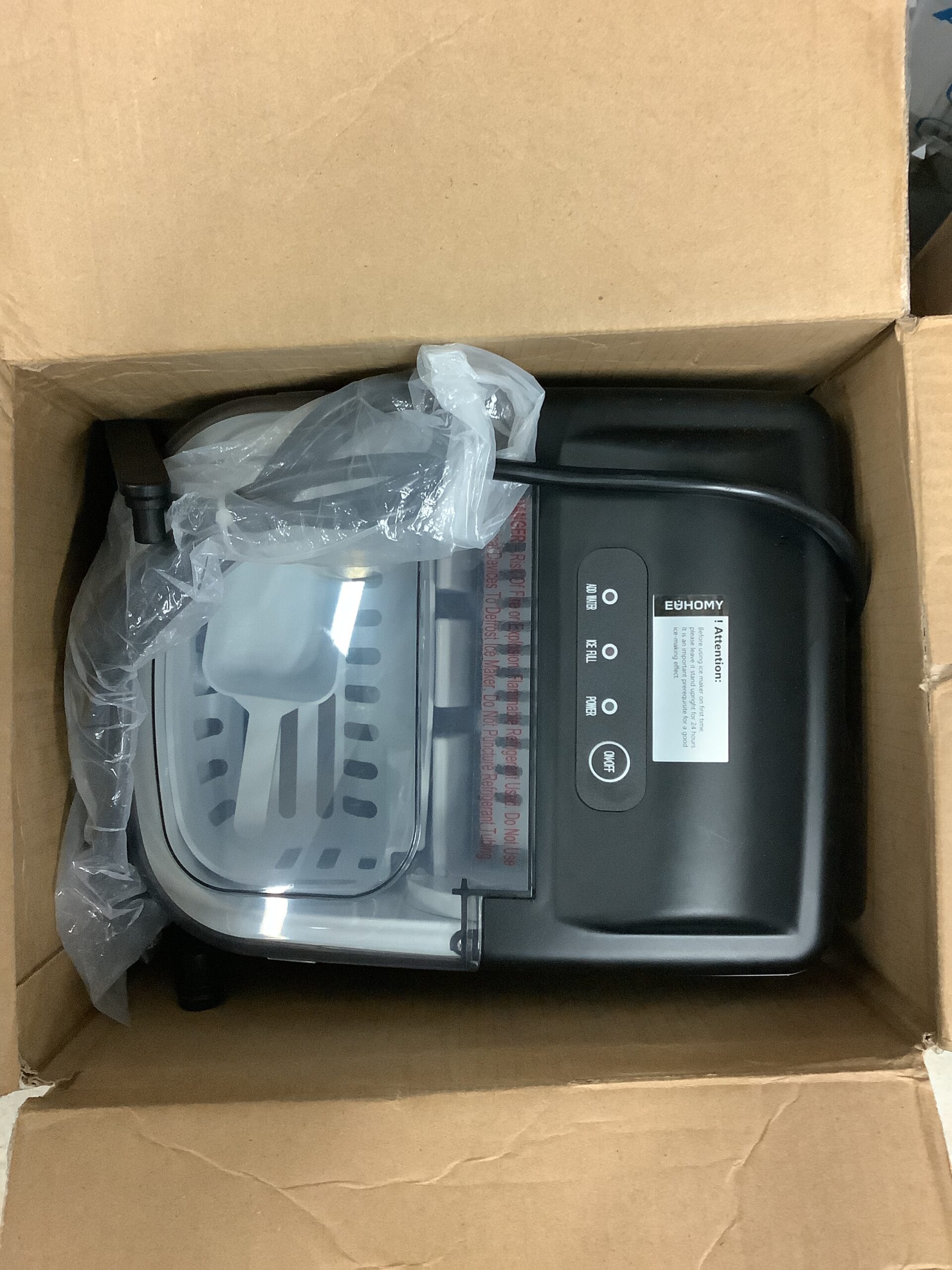 Euhomy countertop ice maker in black with handle and ice basket