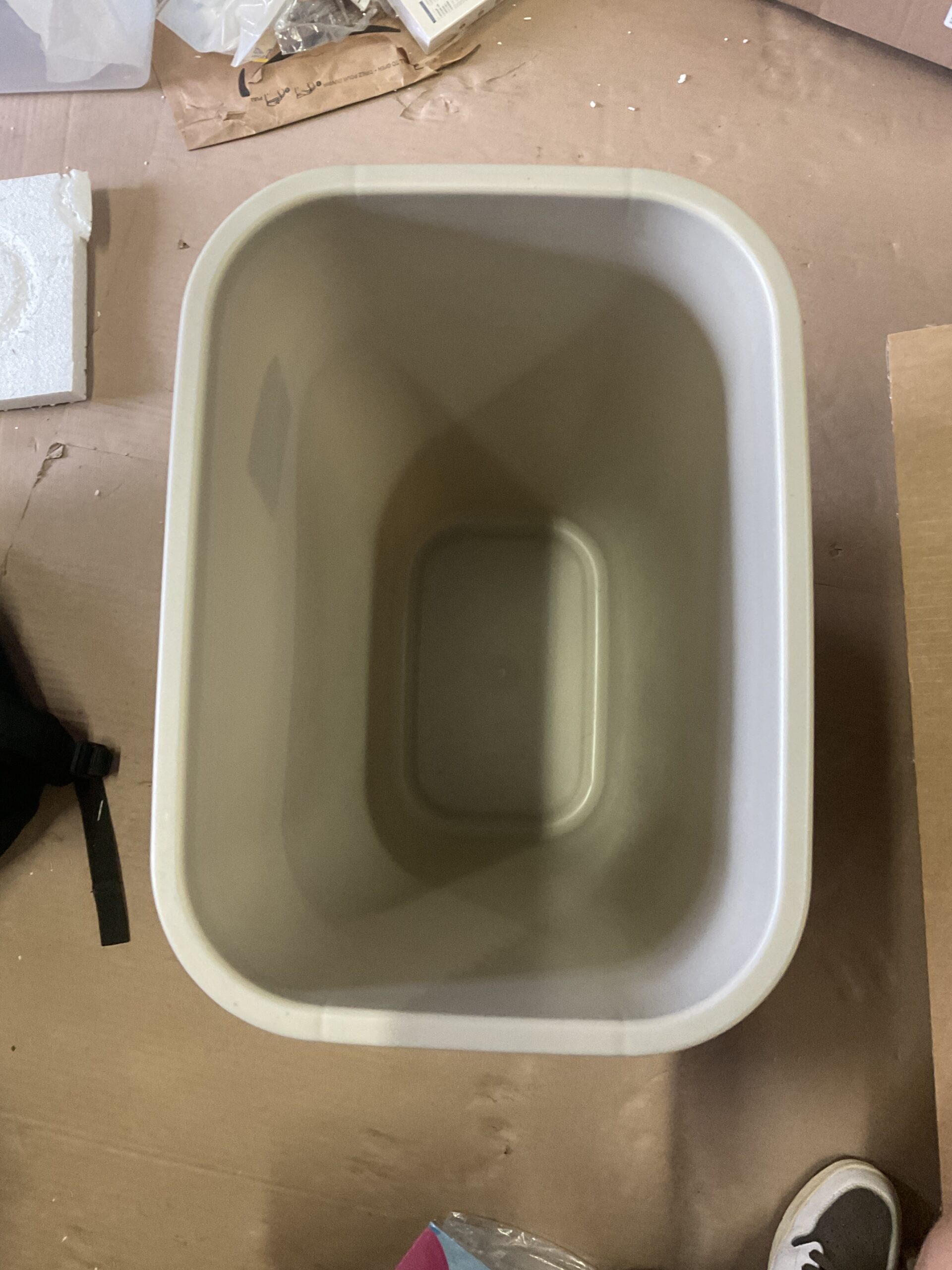 Winco square plastic trash can in beige for commercial use