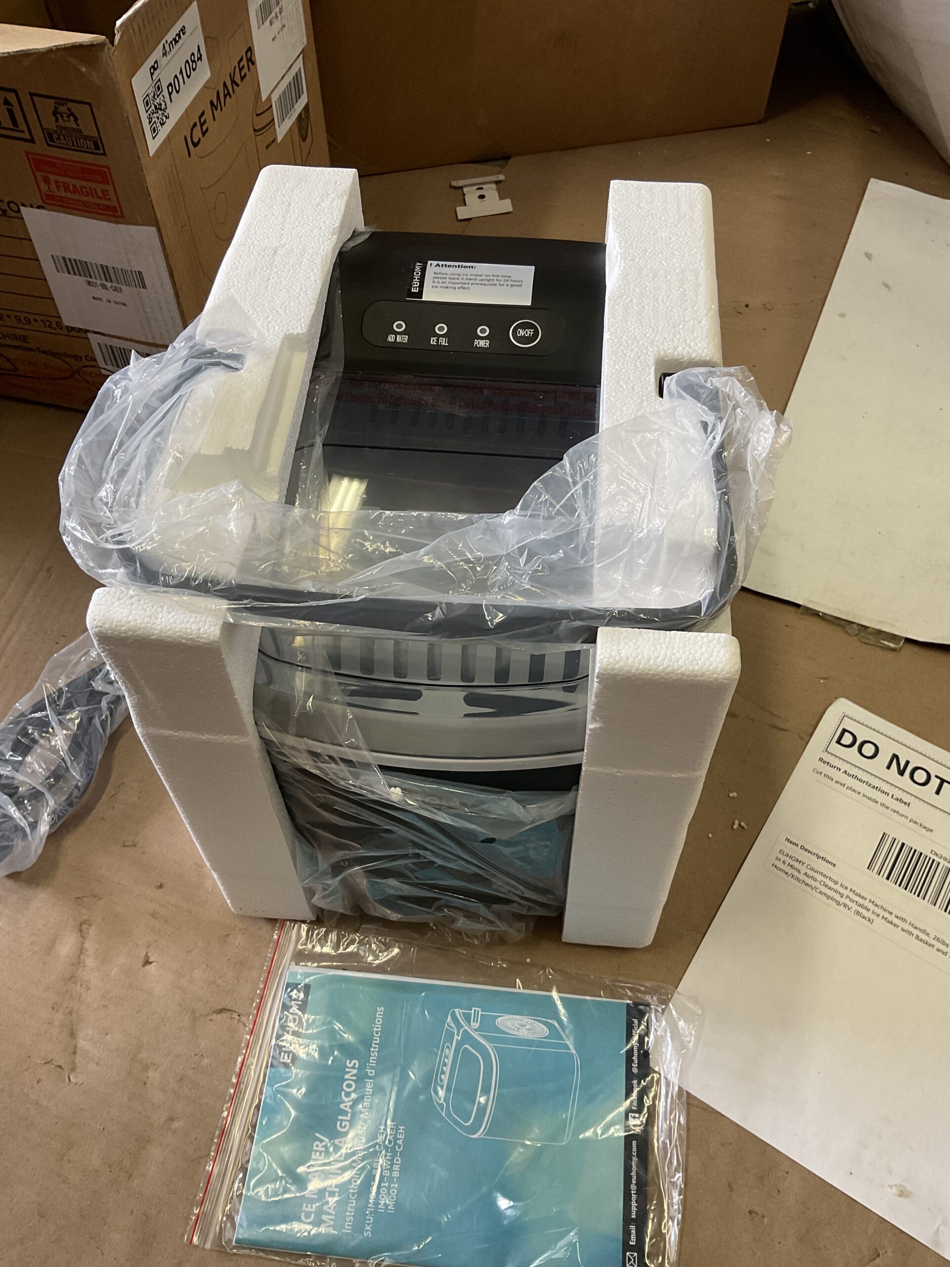 Euhomy countertop ice maker in black with handle and ice basket