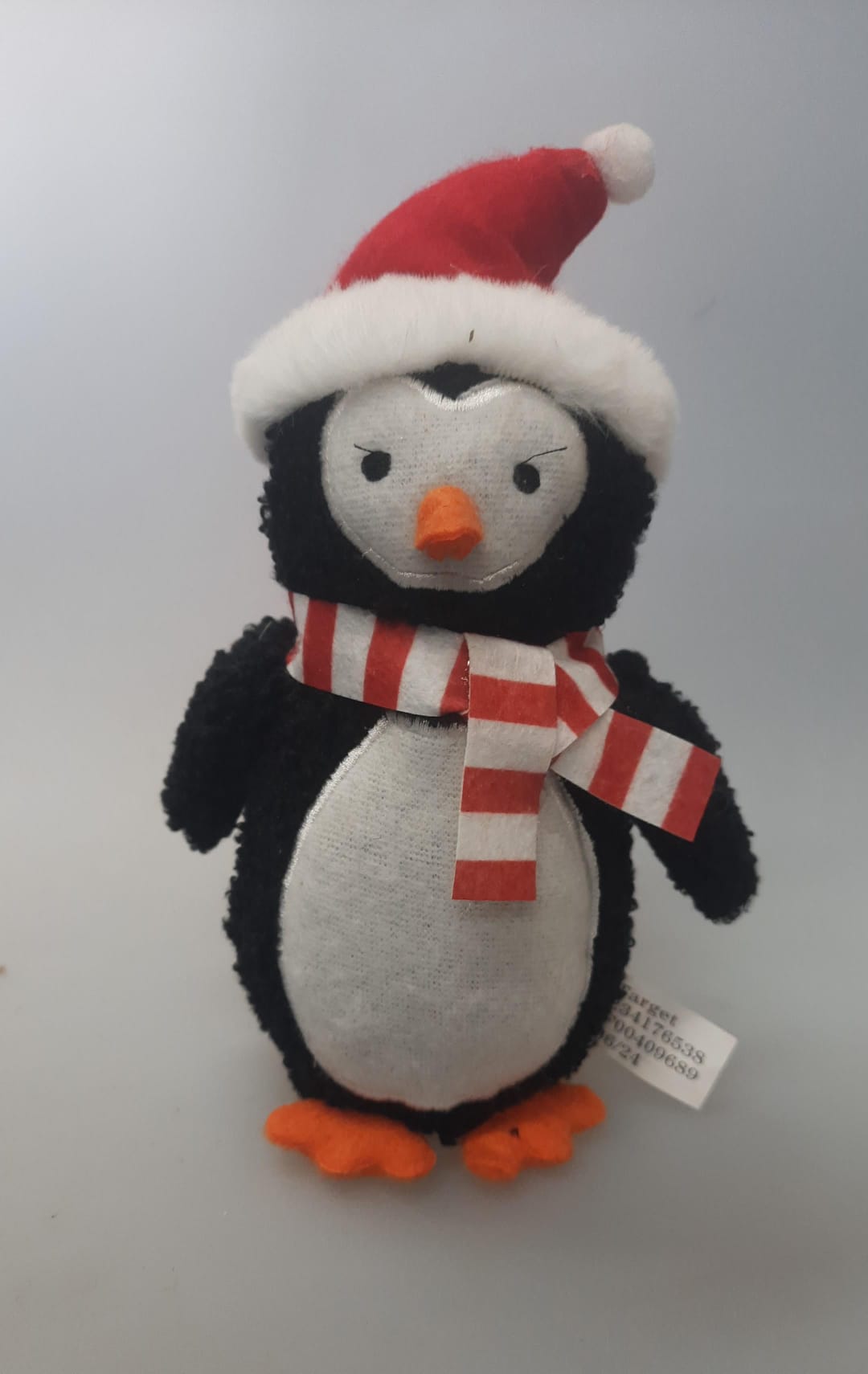 Plush plush penguin in festive holiday design