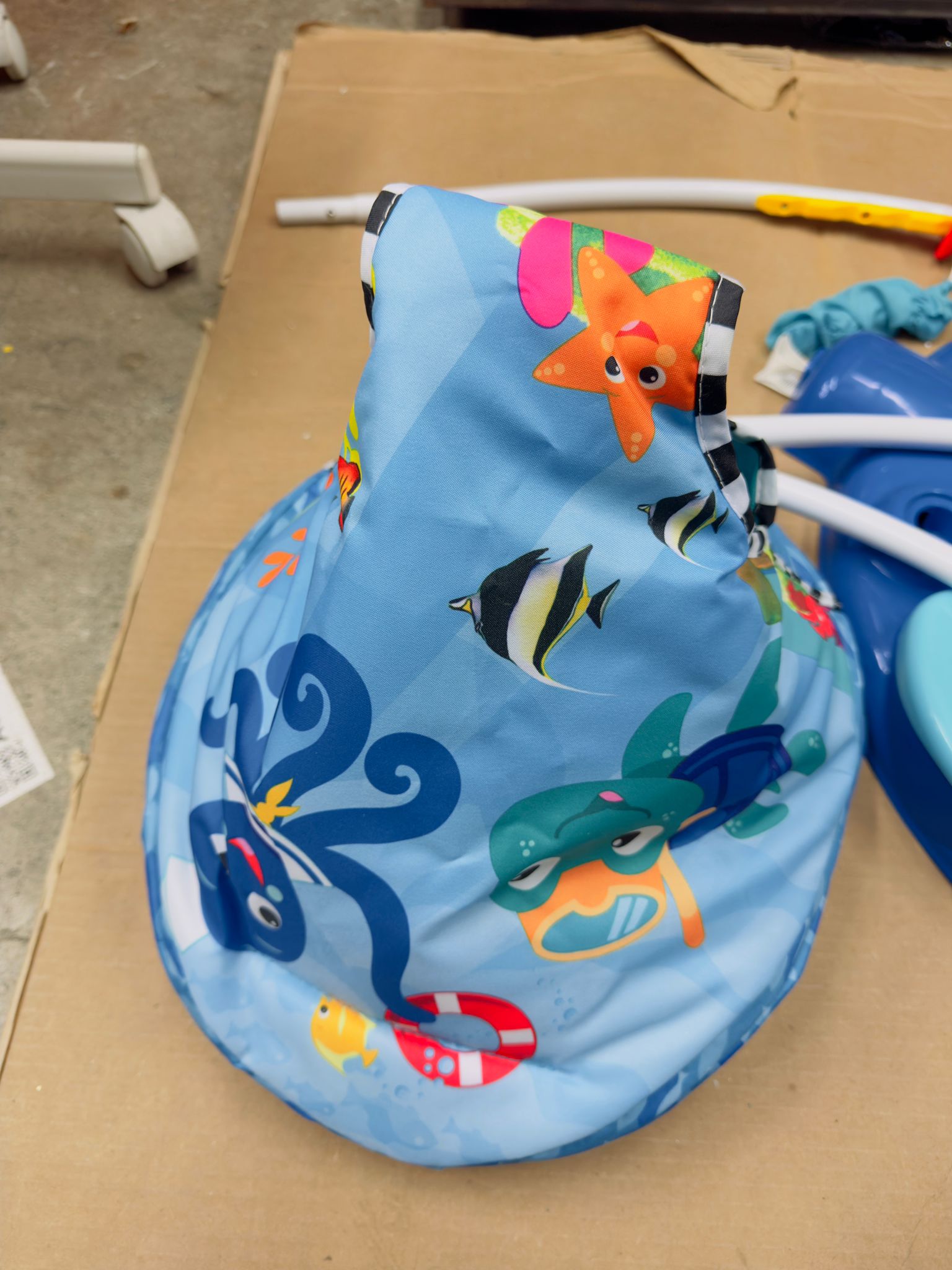 Baby activity jumper in bright ocean theme with interactive toys