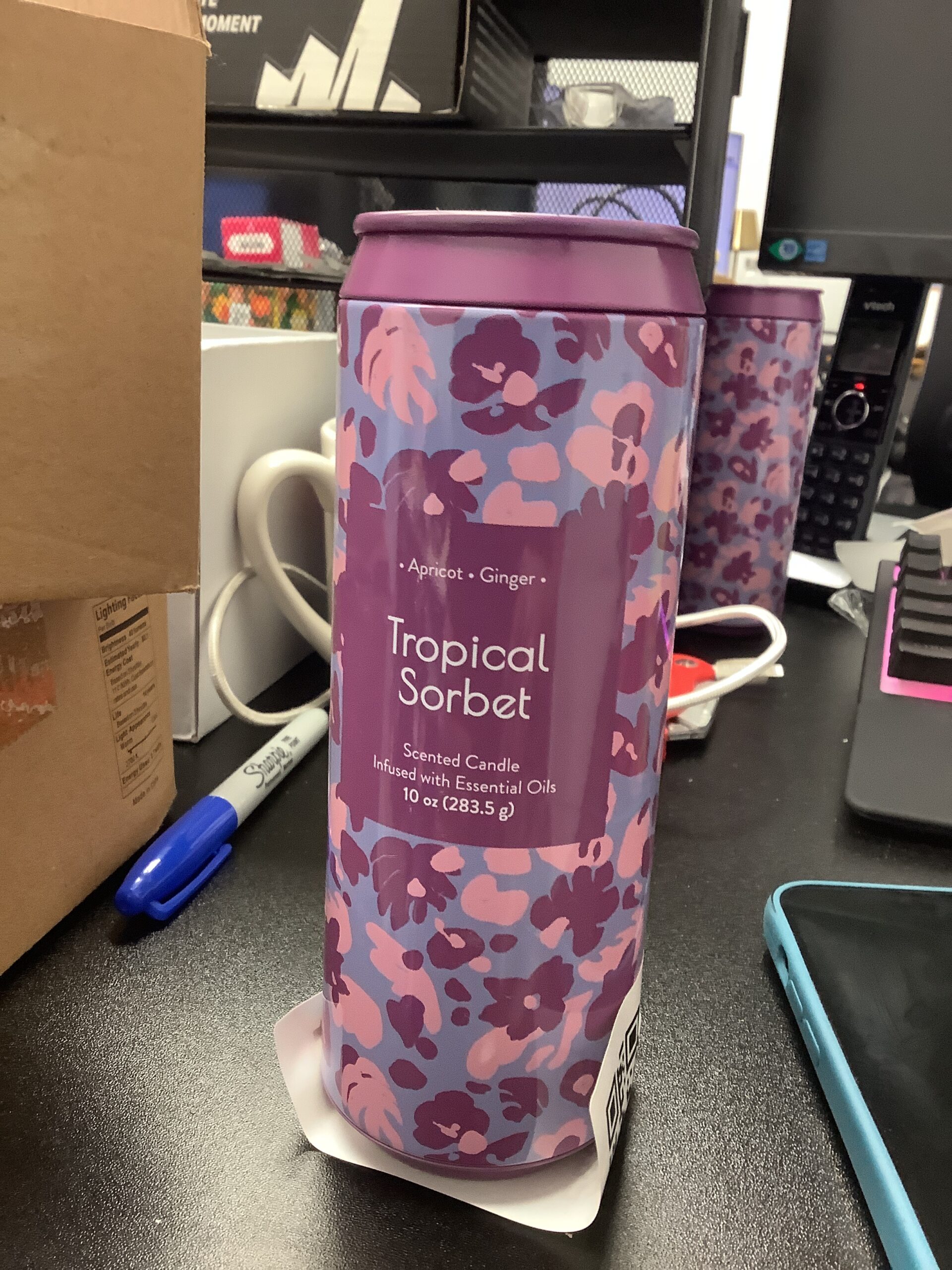 Opal House tropical sorbet scented candle in vibrant tropical setting