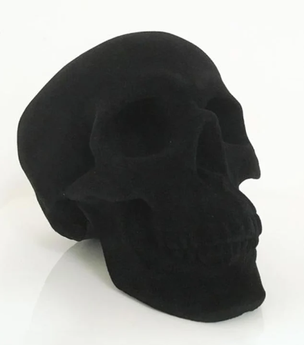 Plastic flocking skull figurine in black finish