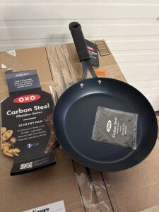 OXO Obsidian 10 inch carbon steel frying pan with removable silicone handle in black