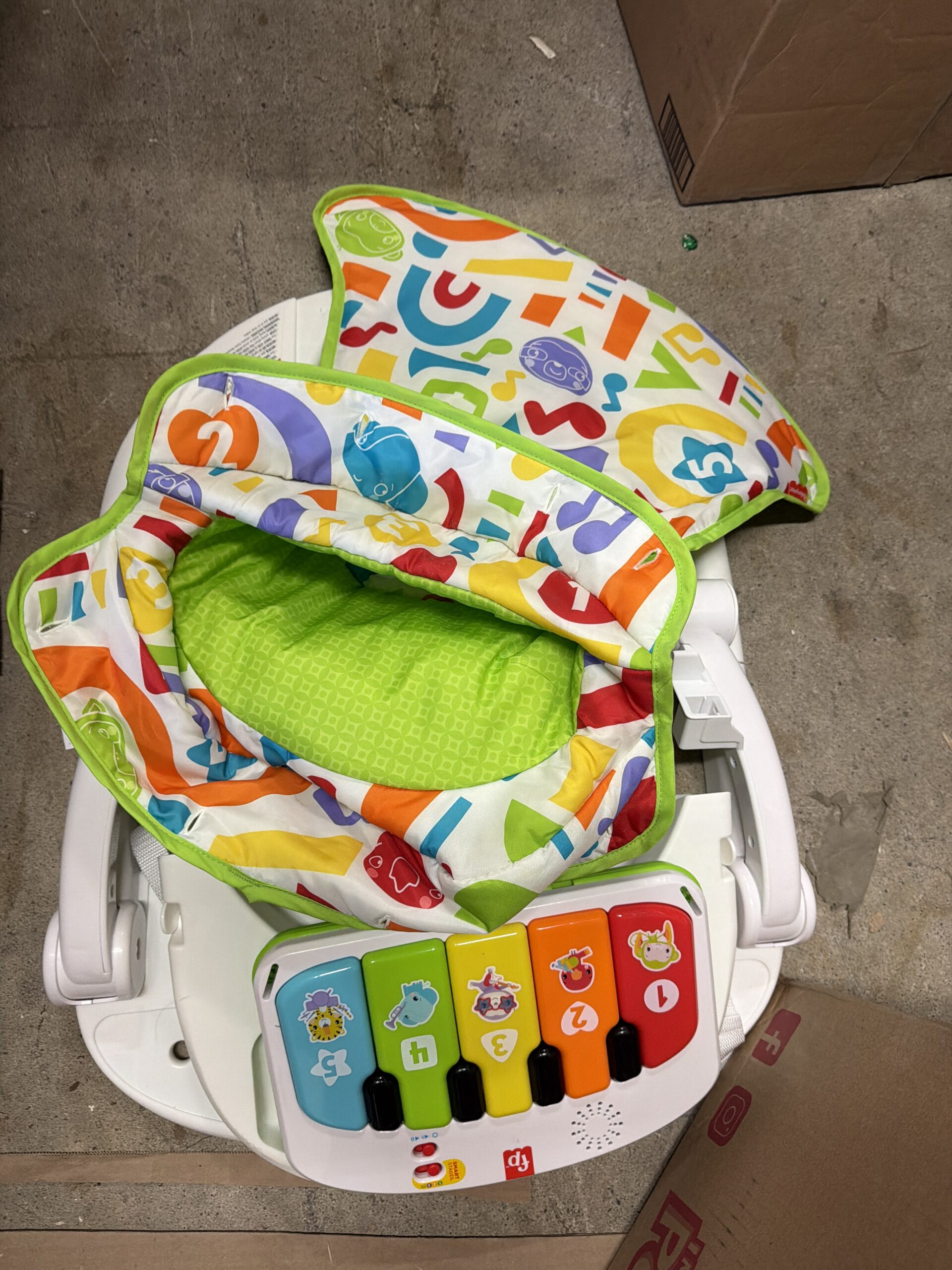 Fisher-Price portable baby chair with piano toy and snack tray
