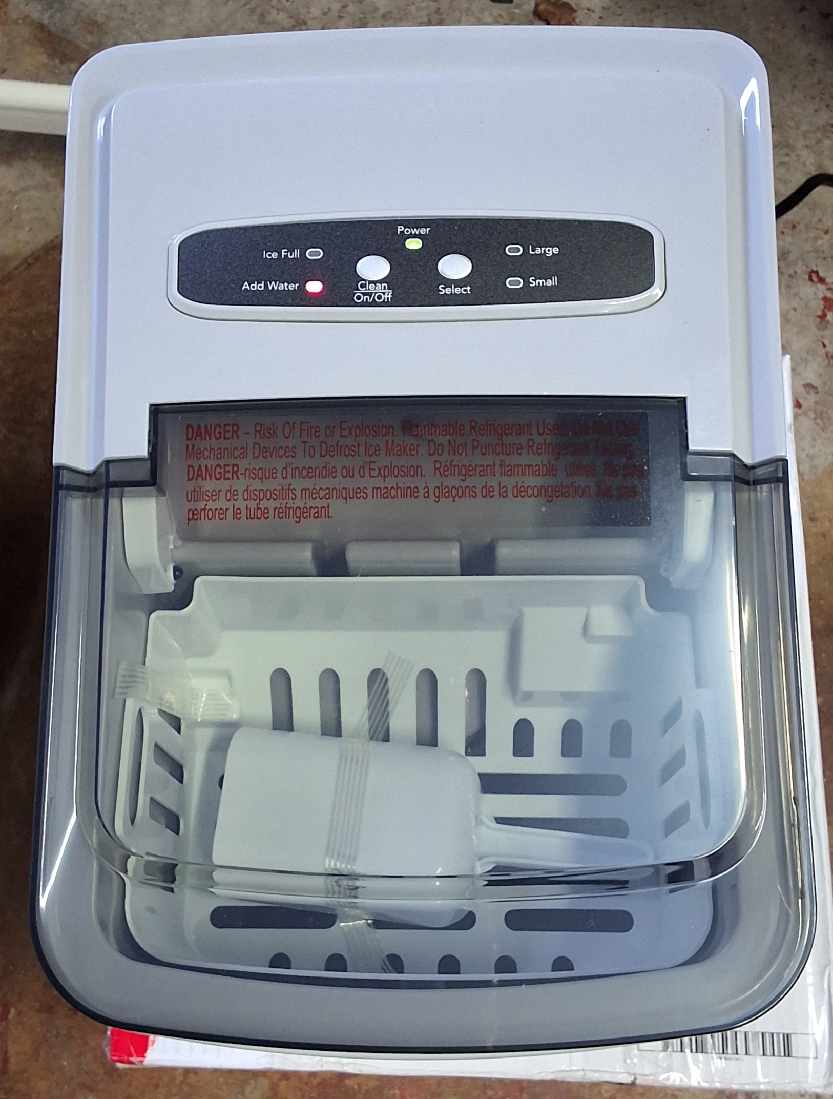 Frigidaire portable ice maker in stainless steel finish with clear window