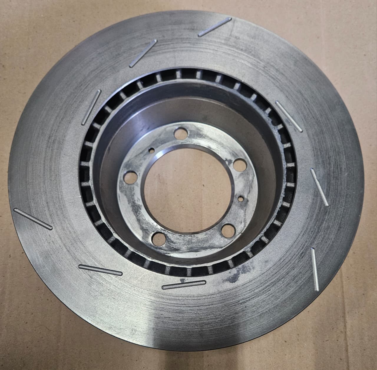 Brembo disc brake rotor in machined cast iron finish