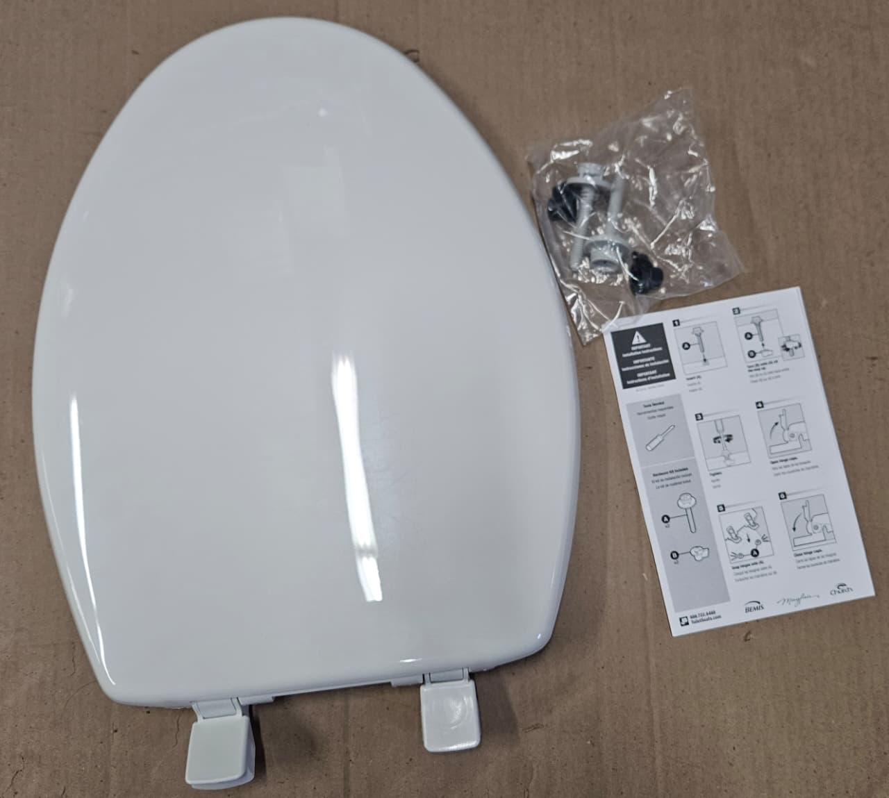 Bemis elongated toilet seat in white slow close design