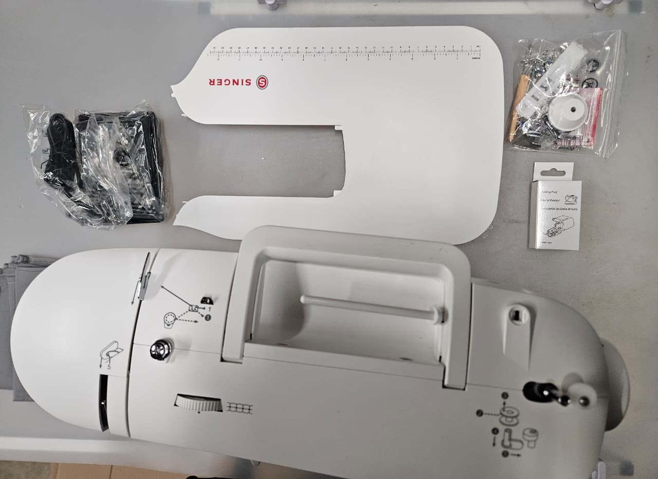 SINGER computerized sewing machine in sleek design with extension table