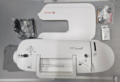 SINGER computerized sewing machine in sleek design with extension table