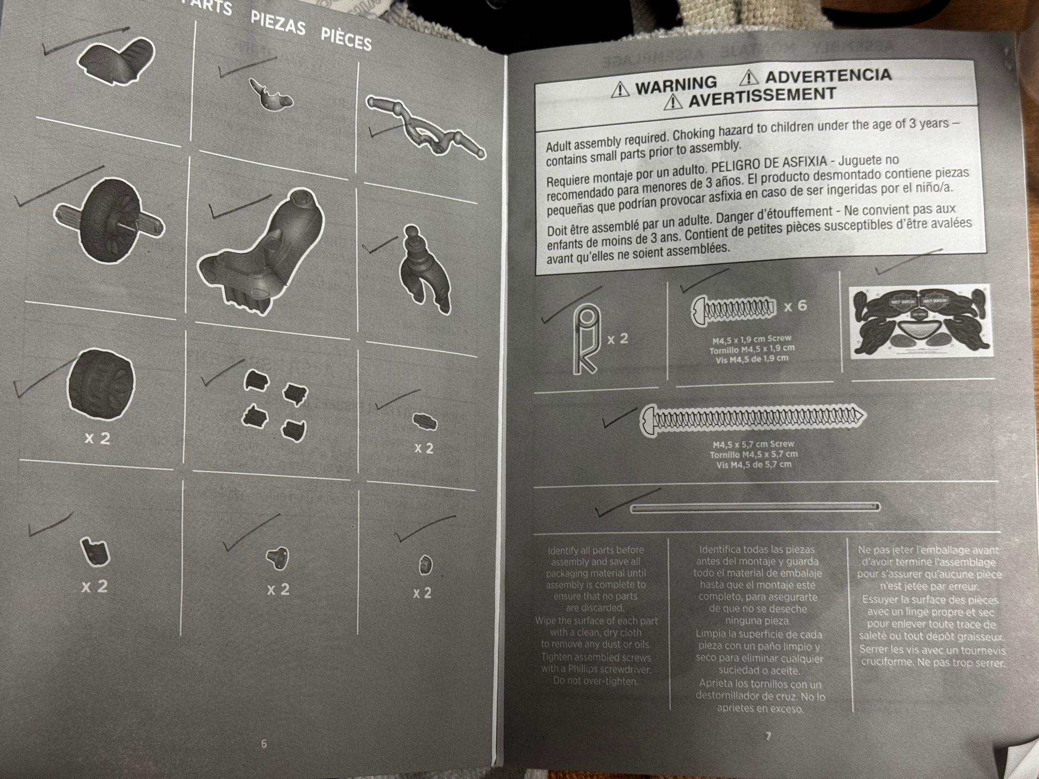 Fisher-Price toddler tricycle in Harley-Davidson design with handlebar grips and storage