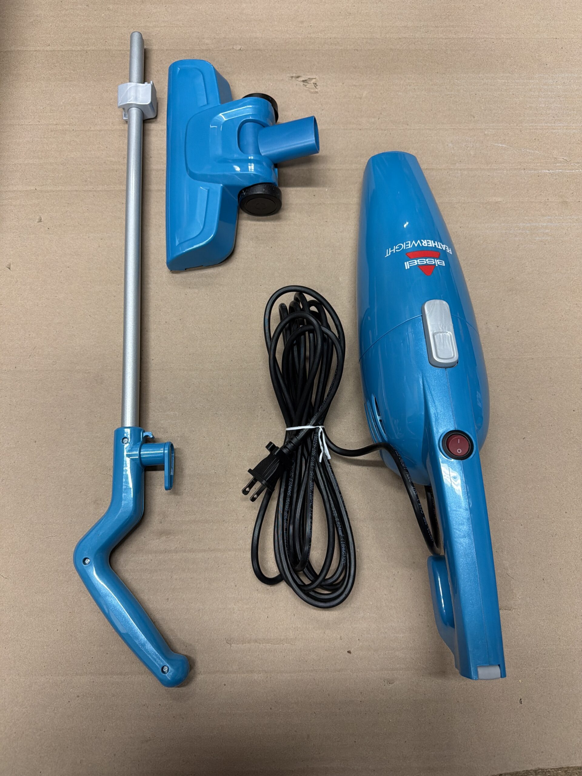 Bissell stick vacuum in featherweight blue with ultra-lightweight and compact design
