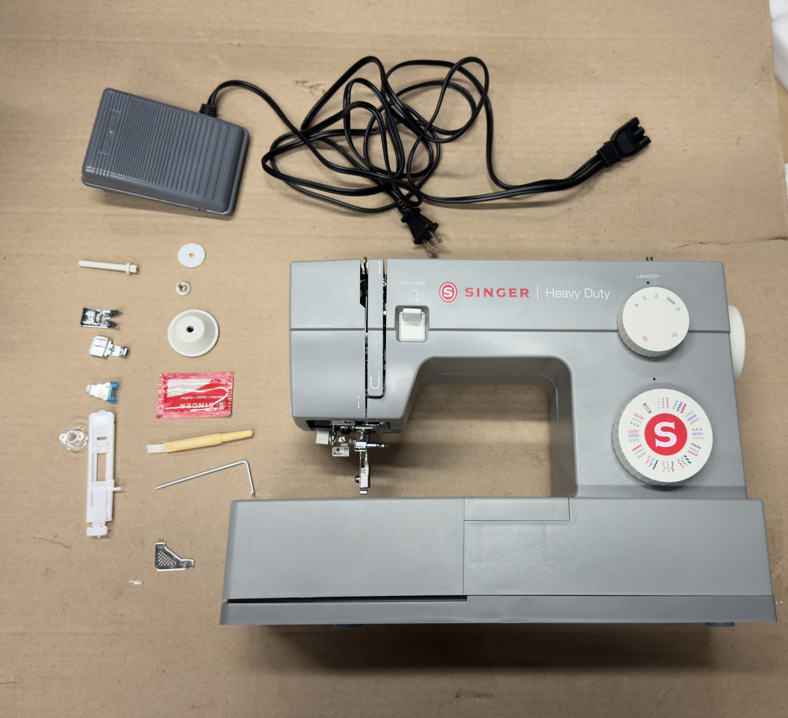 SINGER heavy duty sewing machine in sleek metal finish with accessory kit