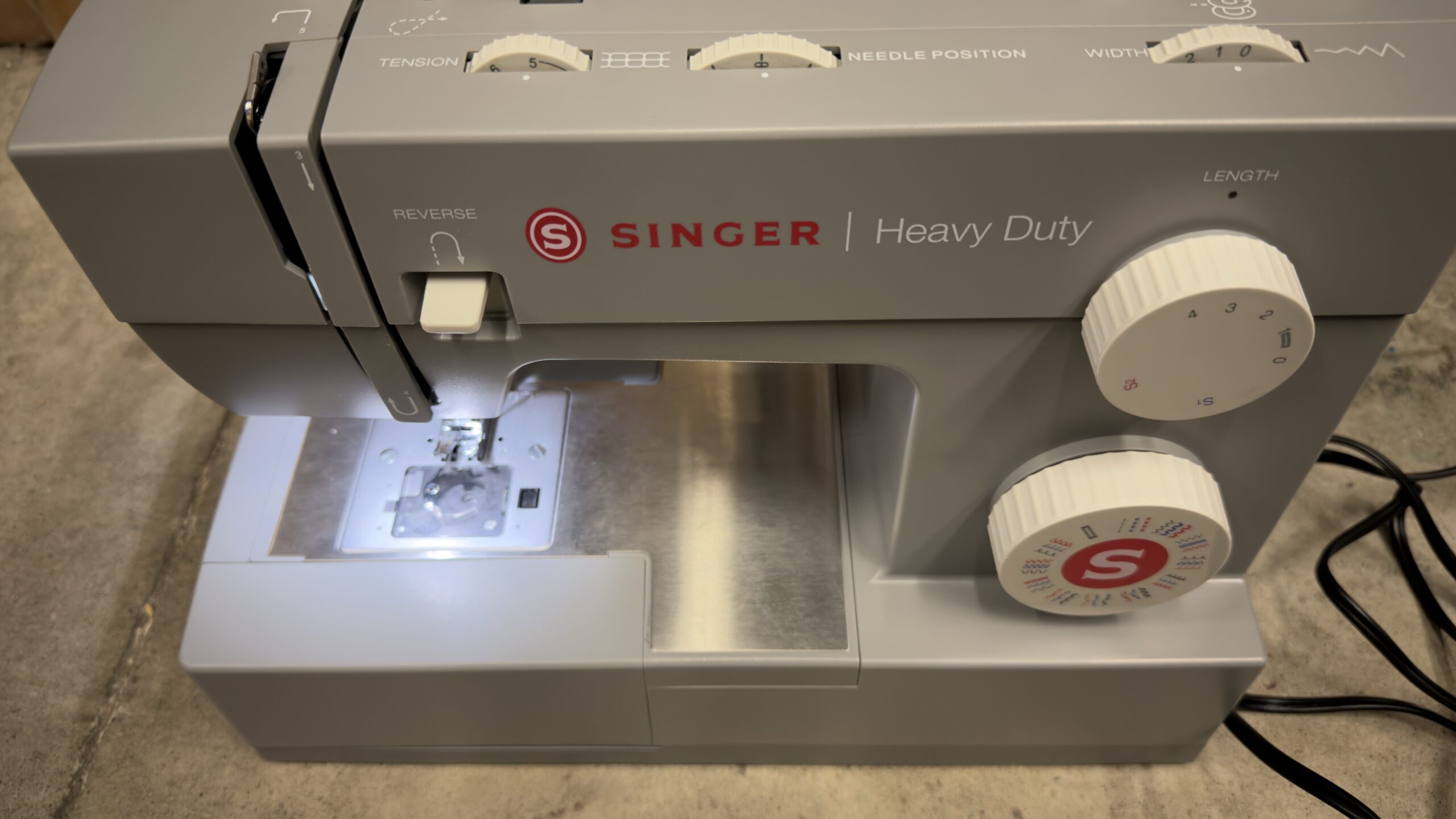 SINGER heavy duty sewing machine in sleek metal finish with accessory kit