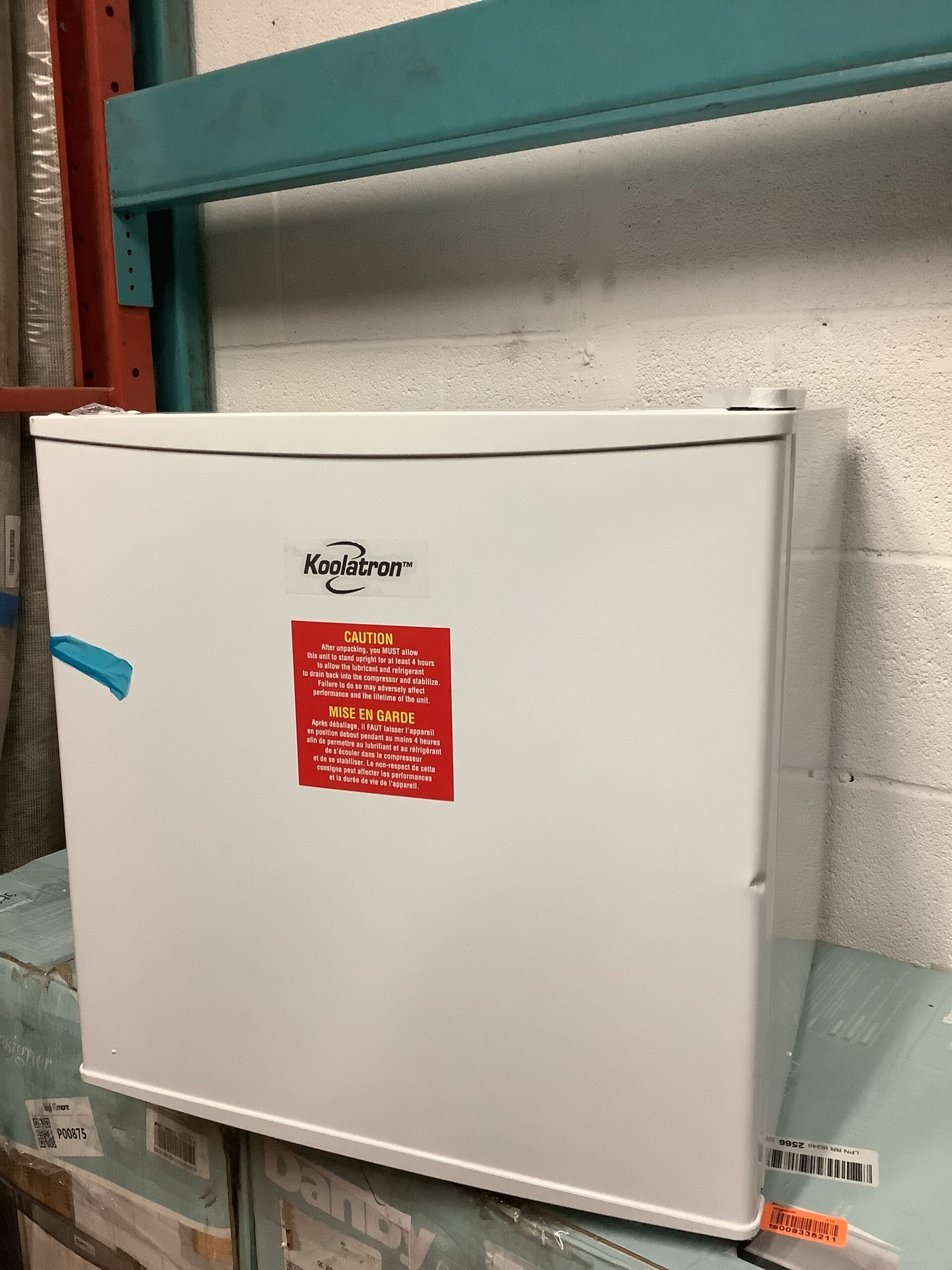 Koolatron mini upright freezer in white, space-saving design